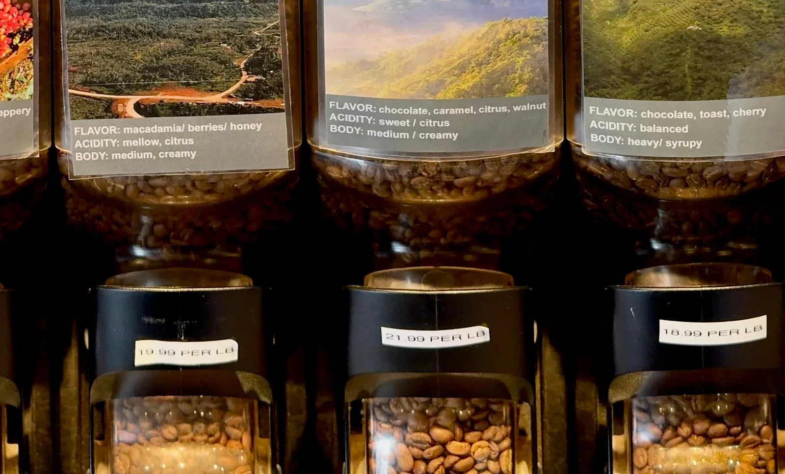 Three bulk coffee jars on the bulk coffee wall