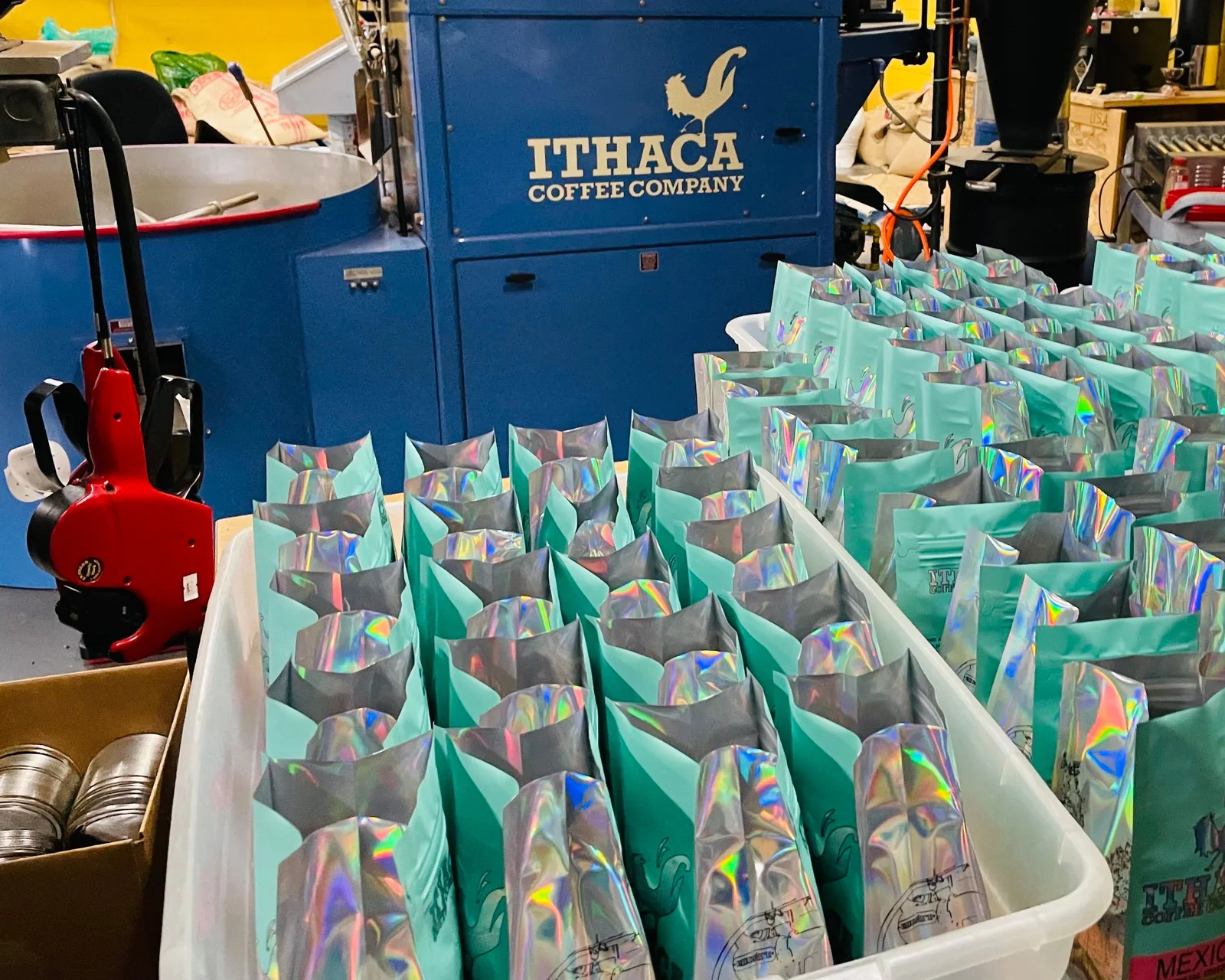Bags of coffee packed beside the roaster